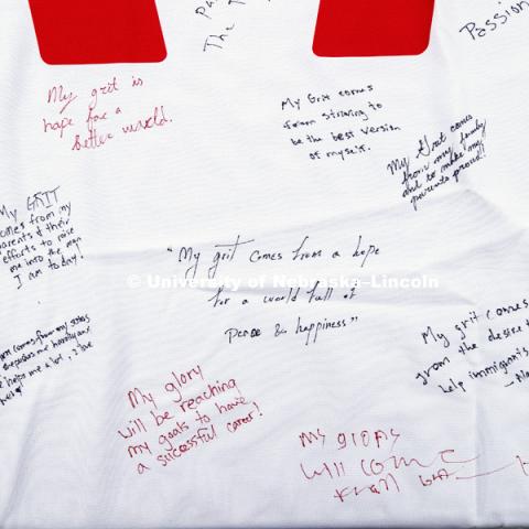 Everyone was asked to sign on a banner what girt and glory meant for them. In Our Grit, Our Glory brand reveal party on city campus at the Nebraska Union. August 30, 2018. Photo by Craig Chandler / University Communication.