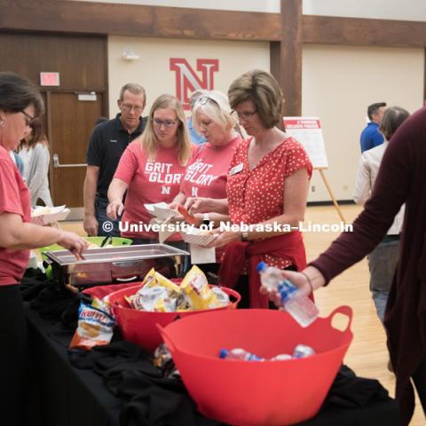 Faculty and staff learn about the new brand before the big reveal to the students. In Our Grit, Our Glory brand reveal party on city campus at the Nebraska Union. August 30, 2018. Photo by Greg Nathan, University Communication.