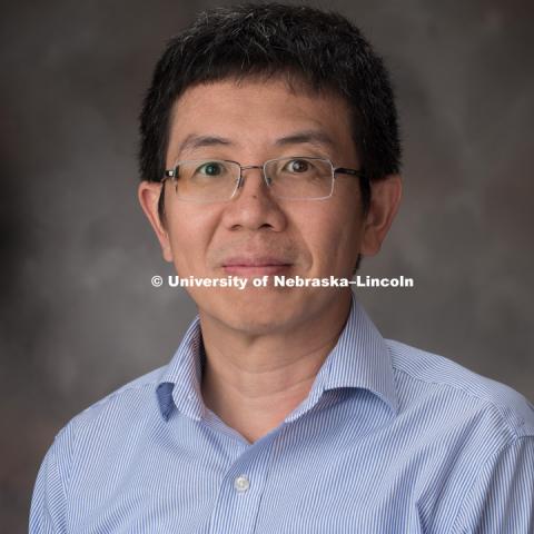 Studio portrait of Jiantao Guo, Associate Professor Chemistry. August 30, 2018. Photo by Greg Nathan, University Communication Photographer.