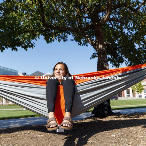 Tina Blaser, junior from Bloomington, Illinois, enjoys the sunshine in the hammocks outside the Nebraska Union. September 10, 2018. Photo by Craig Chandler / University Communication.