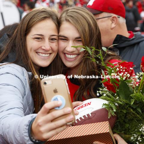 Queen Monica Rogers takes a selfie with friends after being crowned Homecoming Queen. Seniors Gage Hoegermeyer of Herman and Monica Rogers of Omaha were crowned king and queen at the University of Nebraska–Lincoln's homecoming celebration. Hoegermeyer and Rogers, elected in an online vote of the student body on Sept. 27, were crowned on the field at Memorial Stadium during halftime of the Sept. 29 Nebraska-Purdue football game. September 29, 2018. Photo by Craig Chandler / University Communication.