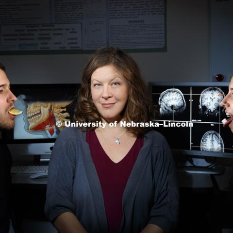 Angela Dietsch, Assistant Professor Special Education and Communication Disorders, is using the sense of taste and MRI scans to help stroke victims recover their swallowing mechanics, PhD student Ross Westemeyer of North Liberty, IA, models sour while grad student Megan Asselin of Lincoln models sweet. November 12, 2018. Photo by Craig Chandler / University Communication.