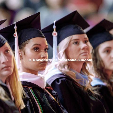 Virginia Hill, Masters in Political Science, listens to the commencement speaker during the Graduate Commencement and Hooding ceremony in Pinnacle Bank Arena. December 14, 2018. Photo by Craig Chandler / University Communication.