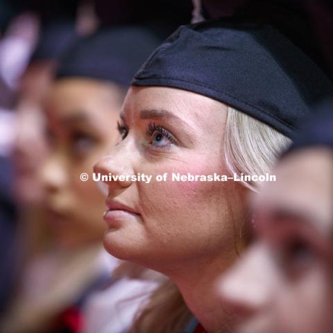 Hillary Hotz, Masters in Educational Administration, watches a welcome video from the Nebraska Alumni Association during the Graduate Commencement and Hooding ceremony in Pinnacle Bank Arena. December 14, 2018. Photo by Craig Chandler / University Communication.