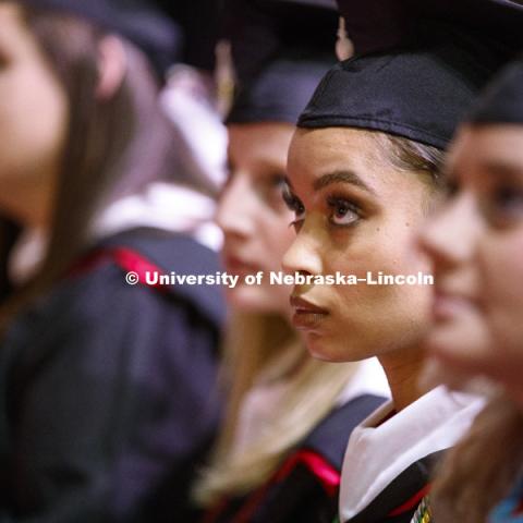 Virginia Hill, Masters in Political Science, watches a welcome video from the Nebraska Alumni Association during the Graduate Commencement and Hooding ceremony in Pinnacle Bank Arena. December 14, 2018. Photo by Craig Chandler / University Communication.