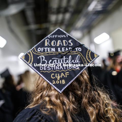 Decorated mortarboard at the Undergraduate Commencement in Pinnacle Bank Arena. December 15, 2018. Photo by Craig Chandler / University Communication.
