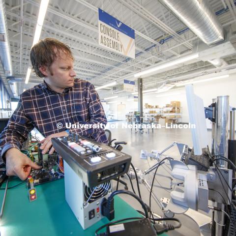 Jason Dumpert works with components in the console assembly area. Virtual Incision has relocated to the newest building on Nebraska Innovation Campus and expanded their footprint to include manufacturing areas for the surgical robots. December 20, 2018. Photo by Craig Chandler / University Communication.