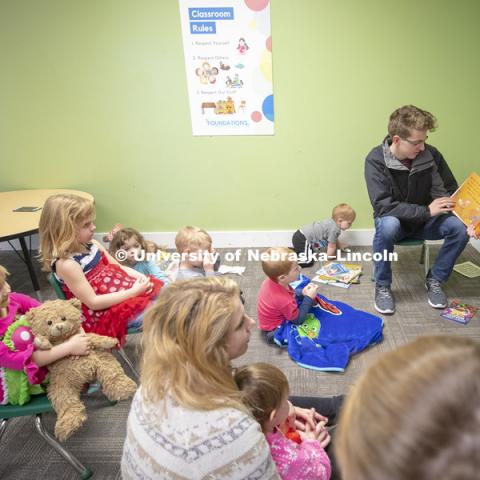 Thomas Kerr, freshman in accounting from Hastings, reads to children Monday morning at the Foundations Progressive Learning Center. Husker Reading Challenge. Students, faculty and staff are invited to honor King’s legacy through a day of service. In collaboration with Prosper Lincoln and Read Aloud Lincoln, the Center for Civic Engagement at Nebraska will host the reading challenge. January 21, 2019. Photo by Craig Chandler / University Communication.