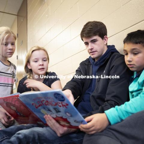 Will Gallagher, freshman in business from Kenesaw, NE, reads at the YMCA of Lincoln-Northeast as part of the Husker Reading Challenge. The UNL students reading at the Y are part of the Chancellor's Leadership Class. Students, faculty and staff are invited to honor King’s legacy through a day of service. In collaboration with Prosper Lincoln and Read Aloud Lincoln, the Center for Civic Engagement at Nebraska will host the reading challenge. January 21, 2019. Photo by Craig Chandler / University Communication.