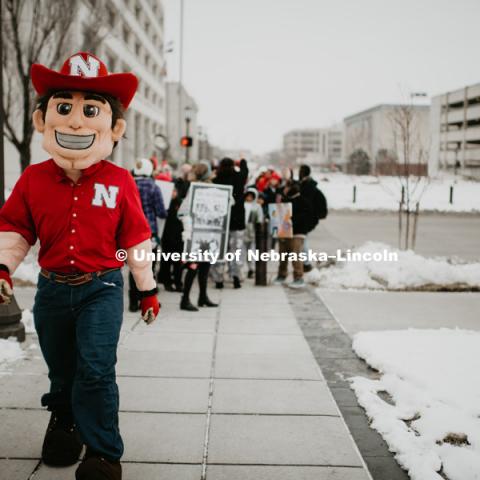 As part of MLK Week, UNL students march with Herbie Husker leading the way in a unifying march through downtown Lincoln and finish with a “Call to Action” program at the Nebraska State Capitol. January 21, 2019. Photo by Justin Mohling for University Communication.