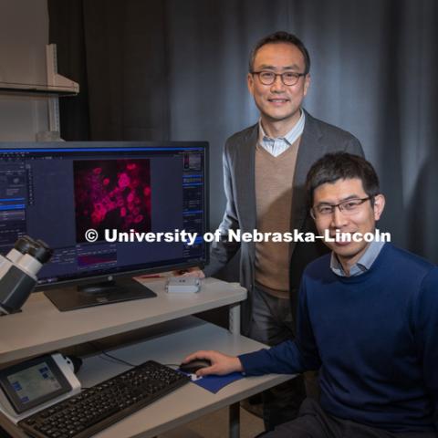 Research done by Ruiguo Yang (right), Jung Yul Lim (left), seeks to understand how individual cells communicate with each other as they respond to environmental changes. January 24, 2019. Photo by Greg Nathan / University Communication.