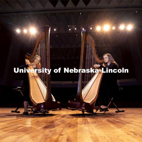 Sarah Brady, left, and Kelly Callahan play the new harps on the Kimball Hall stage. The Glenn Korff School of Music is building its harp program thanks to the recent purchase of two Lyon and Healy harps, one of which was purchased with support from a generous donor. January 28, 2019. Photo by Craig Chandler / University Communication