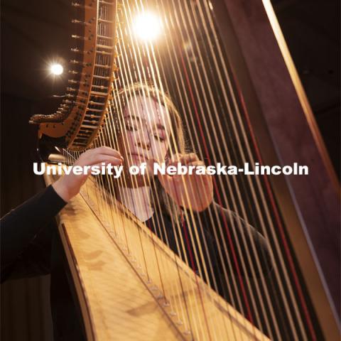 Sarah Brady plays the new harps on the Kimball Hall stage. The Glenn Korff School of Music is building its harp program thanks to the recent purchase of two Lyon and Healy harps, one of which was purchased with support from a generous donor. January 28, 2019. Photo by Craig Chandler / University Communication