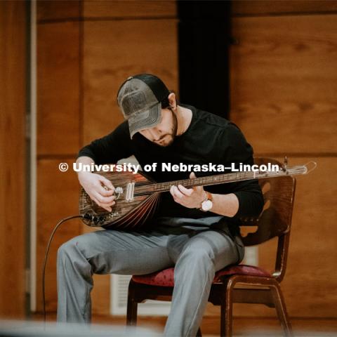 Our Nebraska: Express Yourself Expo in the Oasis Center. A Turkish student plays a sting instrument for the Expo. January 31, 2019. Photo by Justin Mohling / University Communication.