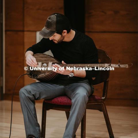 Our Nebraska: Express Yourself Expo in the Oasis Center. A Turkish student plays a sting instrument for the Expo. January 31, 2019. Photo by Justin Mohling / University Communication.