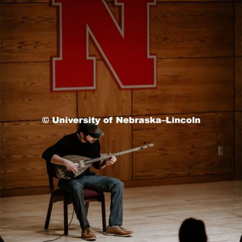 Our Nebraska: Express Yourself Expo in the Oasis Center. A Turkish student plays a sting instrument for the Expo. January 31, 2019. Photo by Justin Mohling / University Communication.