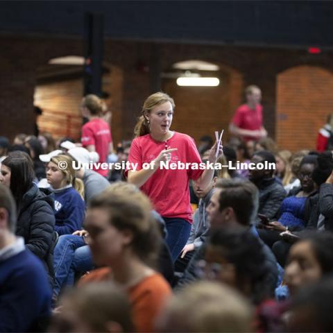 Student volunteers offer the crowd paper to write their questions for the panel. The Charter Week event, “Why Don’t We Get Along? How Huskers Can Change the Future: A Student-led Conversation with Senator Ben Sasse”. February 11, 2019. Photo by Craig Chandler / University Communication.