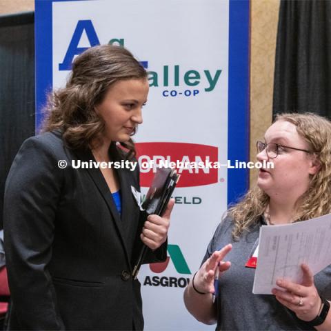 Madison Mills talks with a recruiter from Ag Valley Co-op at the STEM Career Fair (Science, Technology, Engineering, and Math) in Embassy Suites. Sponsored by Career Services. February 12th, 2019. Photo by Gregory Nathan / University Communication.