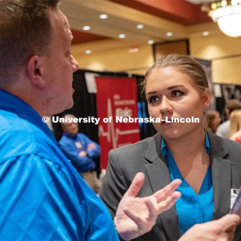 Angelica Wellman speaks with a recruiter at the STEM Career Fair (Science, Technology, Engineering, and Math) in Embassy Suites. Sponsored by Career Services. February 12, 2019. Photo by Gregory Nathan / University Communication.