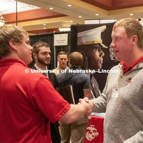 Benjamin Barlean speaks with a recruiter from Ag Valley C0-OP at the STEM Career Fair (Science, Technology, Engineering, and Math) in Embassy Suites. Sponsored by Career Services. February 12, 2019. Photo by Gregory Nathan / University Communication.