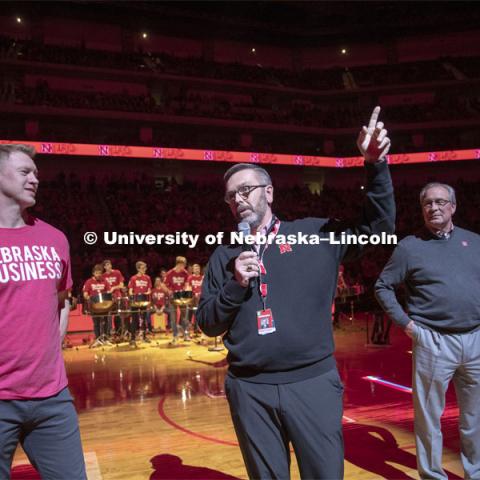 Herbie Husker pops out of a birthday cake as he and head football coach Scott Frost, Chancellor Ronnie Green and Athletic Director Bill Moos help celebrate the university's 150th birthday at the halftime show during the Huskers men’s basketball game. The Huskers played against Minnesota. February 13, 2019. Photo by Craig Chandler / University Communication.