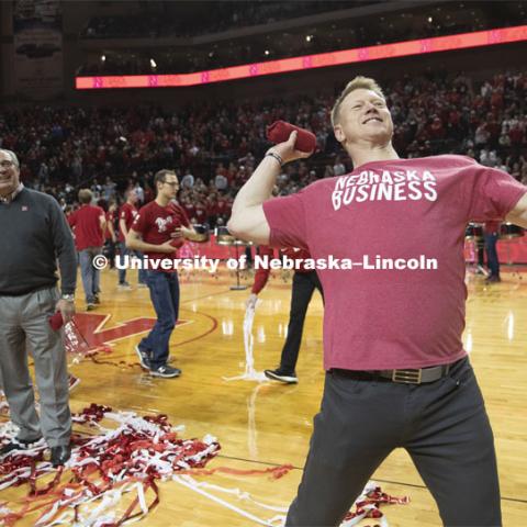 Head football coach Scott Frost, Chancellor Ronnie Green and Athletic Director Bill Moos help celebrate the university's 150th birthday at the halftime show during the Huskers men’s basketball game by throwing t-shirts to the crowd. The Huskers played against Minnesota. February 13, 2019. Photo by Craig Chandler / University Communication.