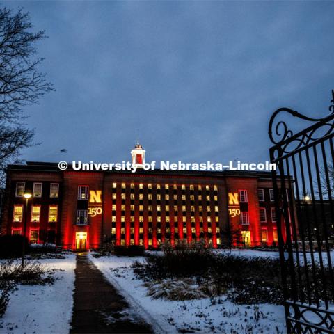Love Library glows in the celebration and is surrounded by fresh-fallen snow. Glow Big Red bathes the campuses with red lights as part of N150's Charter Week celebration. February 15, 2019. Photo by Craig Chandler / University Communication.