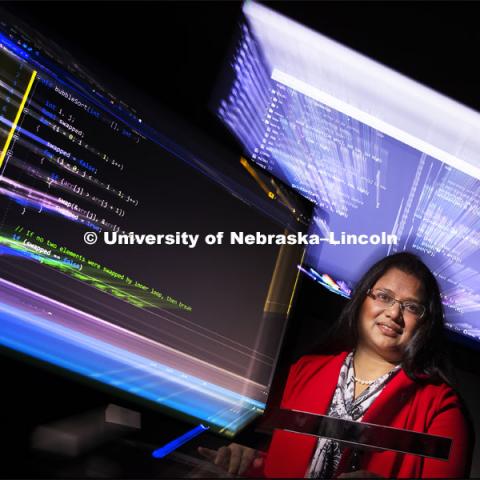 In a world where computer code is overwhelming, Nebraska computer scientist Bonita Sharif assistant professor of computer science and engineering at Nebraska University, is using the latest advances in eye-tracking technology to analyze how experienced software programmers work in order to develop tools that help them write code better and faster. She has earned a $432,000 Faculty Early Career Development Program award from the National Science Foundation to fund the research and related student workshops. The eye-tracking hardware is the small bar on the table in front of Sharif. February 21, 2019. Photo by Craig Chandler / University Communication.
