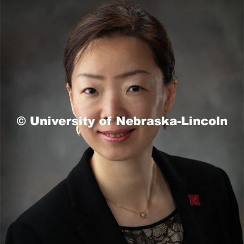 Studio portrait of Bing Cheng, Visiting Scholar, Confucius Institute. March 15, 2019. Photo by Greg Nathan, University Communication.
