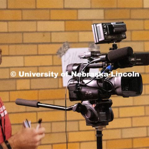 College of Journalism and Mass Communications Broadcast major Brandon Thomas interviews Mike Aerni, site coordinator at the Fremont, Nebraska disaster response distribution center at City Auditorium. April 1, 2019.  Photo by Bernard McCoy / College of Journalism and Mass Communications, University of Nebraska.