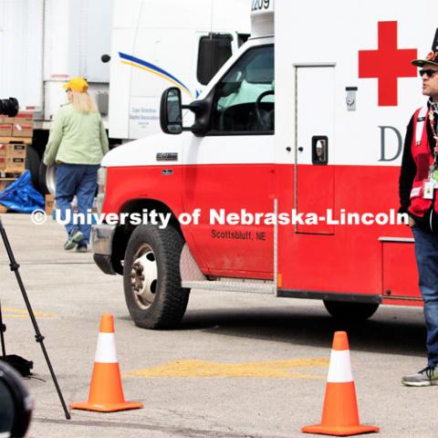 College of Journalism and Mass Communications Photojournalism student Kenneth Ferriera interviews Red Cross Disaster Services volunteer Joel Olavarrio outside a Fremont, Nebraska shelter for residents forced from their homes by a March 13 flood. April 1, 2019.  Photo by Bernard McCoy / College of Journalism and Mass Communications, University of Nebraska.