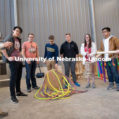 Lincoln Children's Zoo giraffe keeper Nikki Shemanski (left) talks with students (from left) Pin Hao Cheng, Garrett Brockman, John Strope, Brennan Sanders, Kylee Hauxwell, Awang Hashim and Zoe Jirovsky April 2 when the Theme Park Design Group delivered the enrichment toys for the zoo’s three giraffes. April 2, 2019. Photo by Gregory Nathan / University Communication.