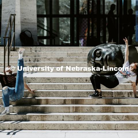 With the Sheldon's Fallen Dreamer as an audience, Cody Hartshorn and Yanzhu Jiang work on their performance piece for the Modern 3-4 dance class. Spring day on city campus as the temperatures reached the 80s. April 8, 2019. Photo by Craig Chandler / University Communication.