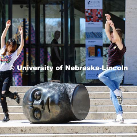 With the Sheldon's Fallen Dreamer as an audience, Cody Hartshorn and Yanzhu Jiang work on their performance piece for the Modern 3-4 dance class. Spring day on city campus as the temperatures reached the 80s. April 8, 2019. Photo by Craig Chandler / University Communication.