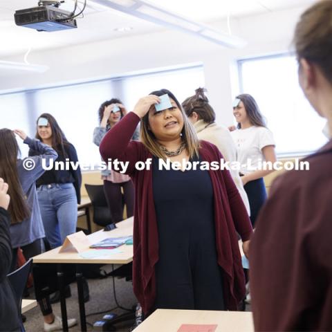 Jemalyn Griffin teaches ADPR 221 - Strategic Writing for Advertising and Public Relations. College of Journalism and Mass Communications classroom photos. Students do an exercise with post it notes stuck to their foreheads. April 11 2019. Photo by Craig Chandler / University Communication.