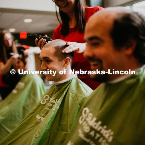 19 individuals volunteered to have their heads shaved for the 2019 St. Baldrick's Foundation fundraiser, a fundraiser for childhood cancer research. The event was held in the Abel-Sandoz Welcome Center. April 11, 2019. Photo by Justin Mohling / University Communication