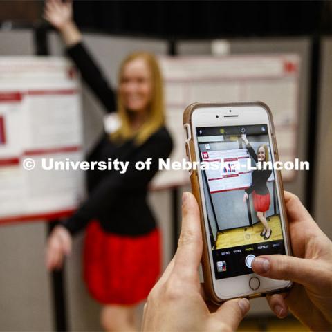 Amanda Nelson has her photo taken with her poster by her friend Shelby Tuder during the Undergraduate Spring Research Fair in the Union ballrooms. April 15, 2019. Photo by Craig Chandler / University Communication.