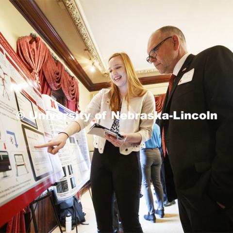 Erica Dolph of Lincoln explains her research "Mobile Platform for Viewing and Transmitting Patient Data- A Transcranial Doppler Pilot Study" to Sen. Tom Brandt of District 32. State Senators Research Fair at the Ferguson House. April 16, 2019. Photo by Craig Chandler / University Communication.