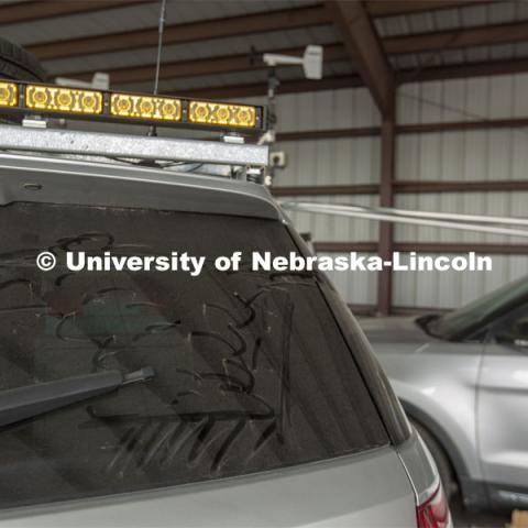 A thunderhead rolls across the dust on the back window of a Nebraska storm chase vehicle. The TORUS research project, which will cover much of the Great Plains in 2019 and 2020, begins May 14. April 26, 2019. Photo by Troy Fedderson / University Communication