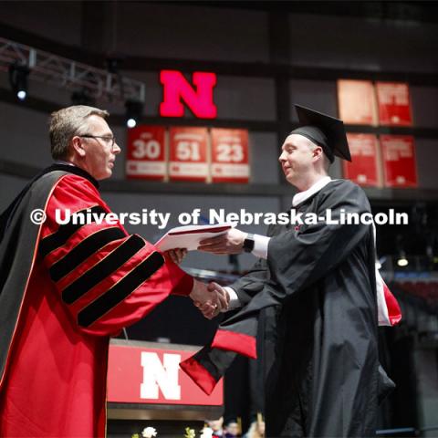 E.J. Stevens receives his master of arts in business degree Friday. 2019 Spring Graduate Commencement in Pinnacle Bank Arena. May 3, 2019. Photo by Craig Chandler / University Communication