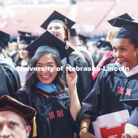 Graduates react after moving their tassels and completing commencement. 2019 Spring Graduate Commencement in Pinnacle Bank Arena. May 3, 2019. Photo by Craig Chandler / University Communication