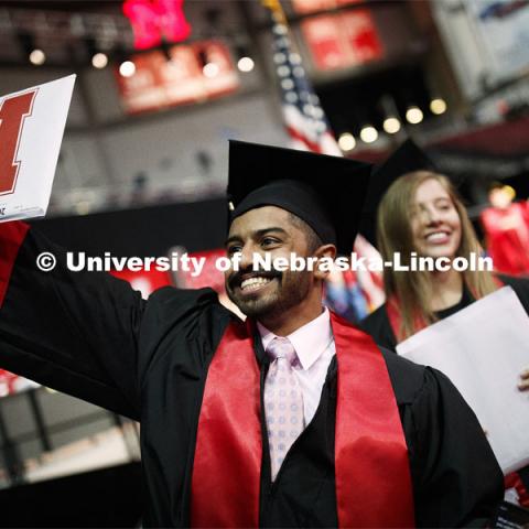 Khaled Saad AlSubaie waves to family and friends as he walks off stage Saturday. Undergraduate commencement at Pinnacle Bank Arena, May 4, 2019. Photo by Craig Chandler / University Communication.