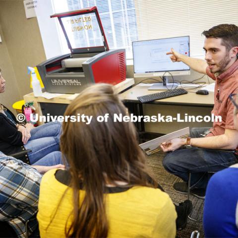 Max Wheeler (pointing to computer screen), NIS instructional designer, leads a training for Library Innovation Studios. Training was held in the Atrium building in downtown Lincoln, Nebraska. May 22, 2019. Photo by Craig Chandler / University Communication.