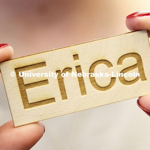 Erica Rogers with the Hastings library shows off her name tag produced by the laser cutter. Library Innovation Studios training for rural Nebraska librarians being taught by Nebraska Innovation Studio in the Atrium building in downtown Lincoln, Nebraska. May 22, 2019. Photo by Craig Chandler / University Communication.