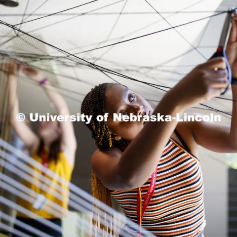 College of Architecture High School Workshop students use string to design in the atrium of the college. June 20, 2019. Photo by Craig Chandler / University Communication.