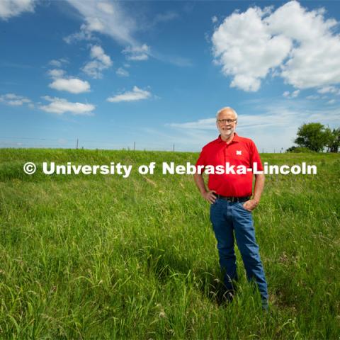 Walter Schacht, professor in Department of Agronomy and Horticulture at the University of Nebraska–Lincoln takes a look at the roots of grass at Nine Mile Prairie. Photo for the 2019 publication of the Strategic Discussions for Nebraska magazine. July 1, 2019, Photo by Gregory Nathan / University Communication.
