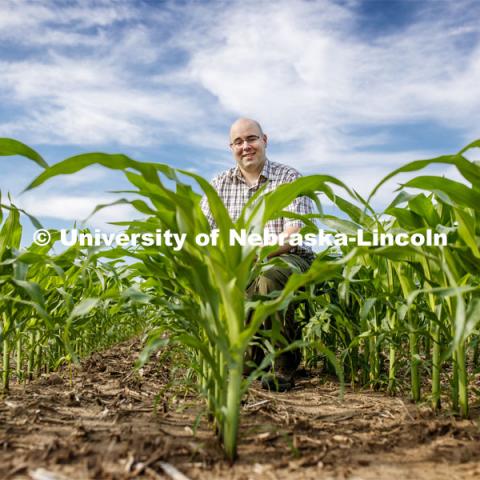 James Schnable, Assistant Professor of Agronomy and Horticulture, is sequencing crop DNA in corn to make it adapt to more specific climates. Photo used for 2018-2019 Annual Report on Research at Nebraska. July 2, 2019. Photo by Craig Chandler / University Communication.