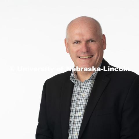 Studio portrait of John Shrader, Assistant Professor of Broadcasting. July 8, 2019. Photo by Greg Nathan / University Communication Photography.