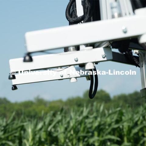 Santosh Pitla, associate professor of advanced machinery systems in the Department of Biological Systems Engineering at the University of Nebraska–Lincoln, is currently developing an autonomous tractor using ground robotics. Pitla and his team are testing their driverless tractor at the Agricultural Research and Development Center (ARDC, MEAD). The autonomous tractors are named Flexible Structured Robotic Vehicle (FlexRo), the tractor is currently used for plant phenotyping, which is measuring the physical characteristics of the plant. According to Pitla, cameras are added to the machine to collect images that characterize plant conditions. Photo for the 2019 publication of the Strategic Discussions for Nebraska magazine. July 17, 2019, Photo by Gregory Nathan / University Communication. 

