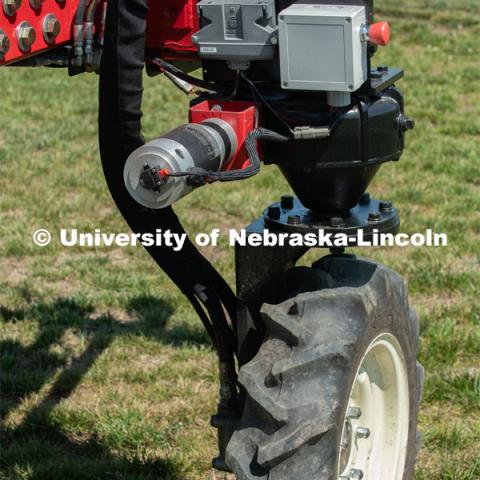 Santosh Pitla, associate professor of advanced machinery systems in the Department of Biological Systems Engineering at the University of Nebraska–Lincoln, is currently developing an autonomous tractor using ground robotics. Pitla and his team are testing their driverless tractor at the Agricultural Research and Development Center (ARDC, MEAD). The autonomous tractors are named Flexible Structured Robotic Vehicle (FlexRo), the tractor is currently used for plant phenotyping, which is measuring the physical characteristics of the plant. According to Pitla, cameras are added to the machine to collect images that characterize plant conditions. Photo for the 2019 publication of the Strategic Discussions for Nebraska magazine. July 17, 2019, Photo by Gregory Nathan / University Communication. 

